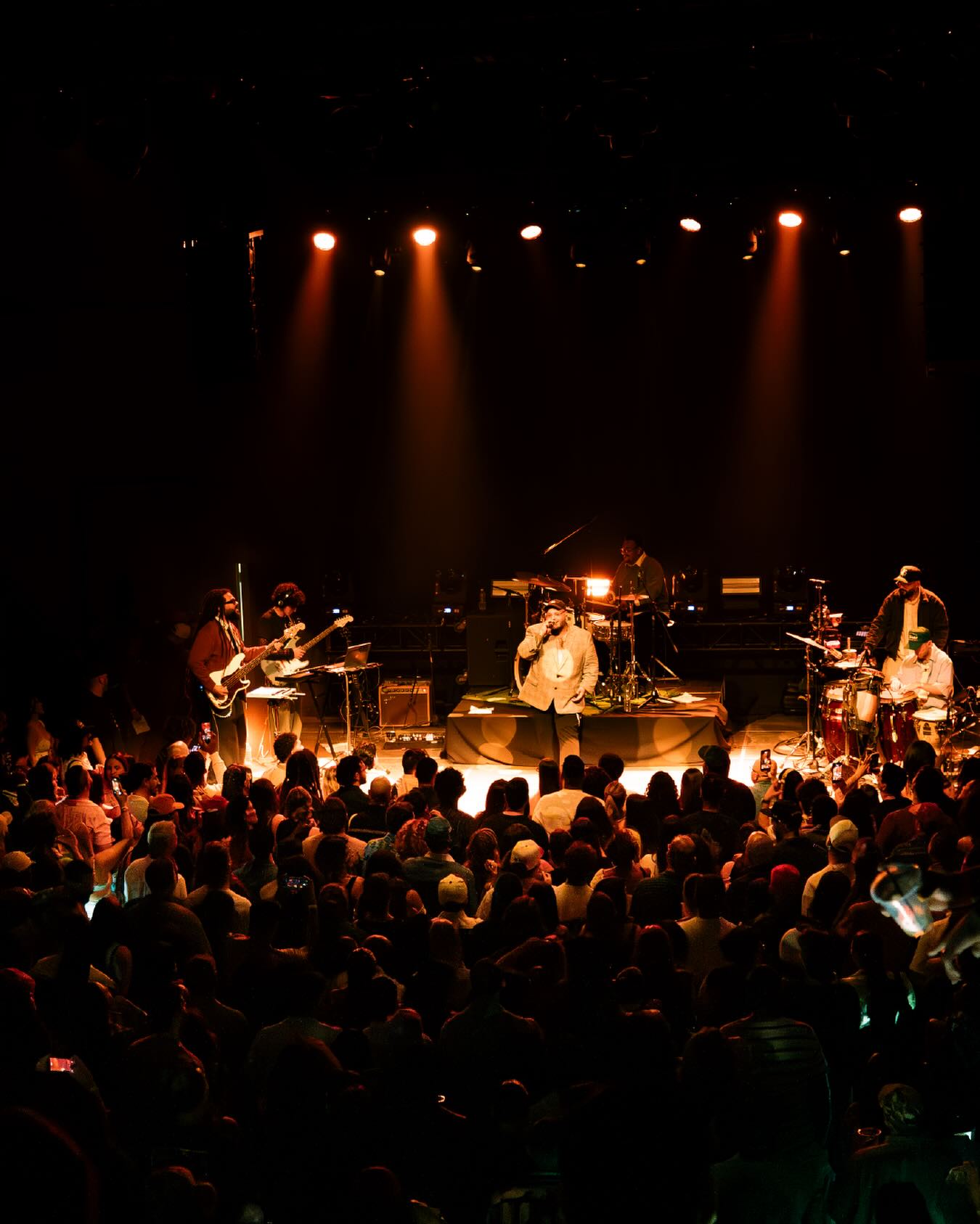 Concert audience and artist viewed from above
